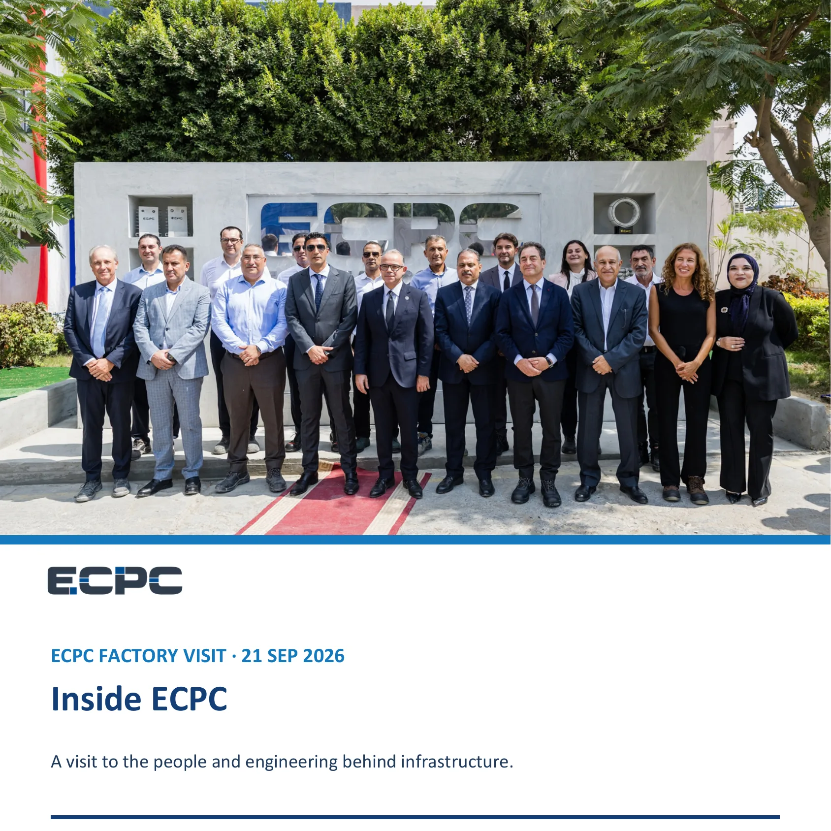 Egyptian French delegation including Ministers and French Ambassador posing in front of the ECPC logo outside the manufacturing plant.
